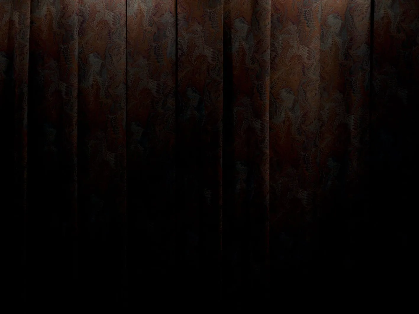 A heavy patterned curtain in reddish brown, its vertical folds catching the light at the top and dissolving into black at the bottom.